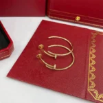 Chic Gold Large Nail Hoop Earrings with Sparkling Accents - Image 6