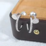 Chic Silver Nail Hoop Earrings with Sparkling Accents - Image 6