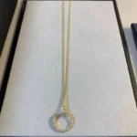 Glamorous Gold Circle Pendant Necklace with Full Stone Accents - Image 3